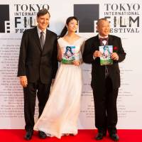 Jacques Cluzaud, co-director of \"Seasons,\" with actress Fumino Kimura (center) and comedian Shofukutei Tsurube, prior to the opening of the 28th Tokyo International Film Festival. | MANCE THOMPSON