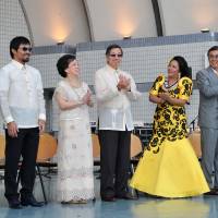 From left, Parliamentary Vice-Minister for Foreign Affairs Takashi Uto; boxer Manny Pacquiao; Maria Teresa, the Philippine Ambassador\'s wife; Philippine Ambassador Manuel M. Lopez; Jenavilla Shigemizu, chairperson of the Philippine Festival 2015; Nobuteru Ishihara, vice chair of the Japan-Philippines Parliamentarians Friendship League; and Miss Universe Tokyo 2014 First Runner Up and Miss Philippines-Japan 2013 Mayu Eustaquio Murakami following the ribbon-cutting ceremony of the Philippine Festival 2015 at Yoyogi Park event square on Sept. 19 | YOSHIAKI MIURA
