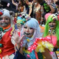 People decked out in a variety of costumes participate in a parade in Kawasaki on Sunday during Kawasaki Halloween 2015. The annual event, now in its 19th year, brought together some 2,500 people and stretched for about 1.5 km. | SATOKO KAWASAKI