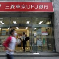 A branch of Bank of Tokyo Mitsubishi UFJ is seen in Tokyo. The nation\'s mega-banks are boosting lending in Australia that offers higher margins on loans. | BLOOMBERG