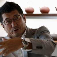 Car designer Ken Okuyama says the days of cheap cars may be numbered as technology firms Google and Apple muscle into the auto industry. | REUTERS