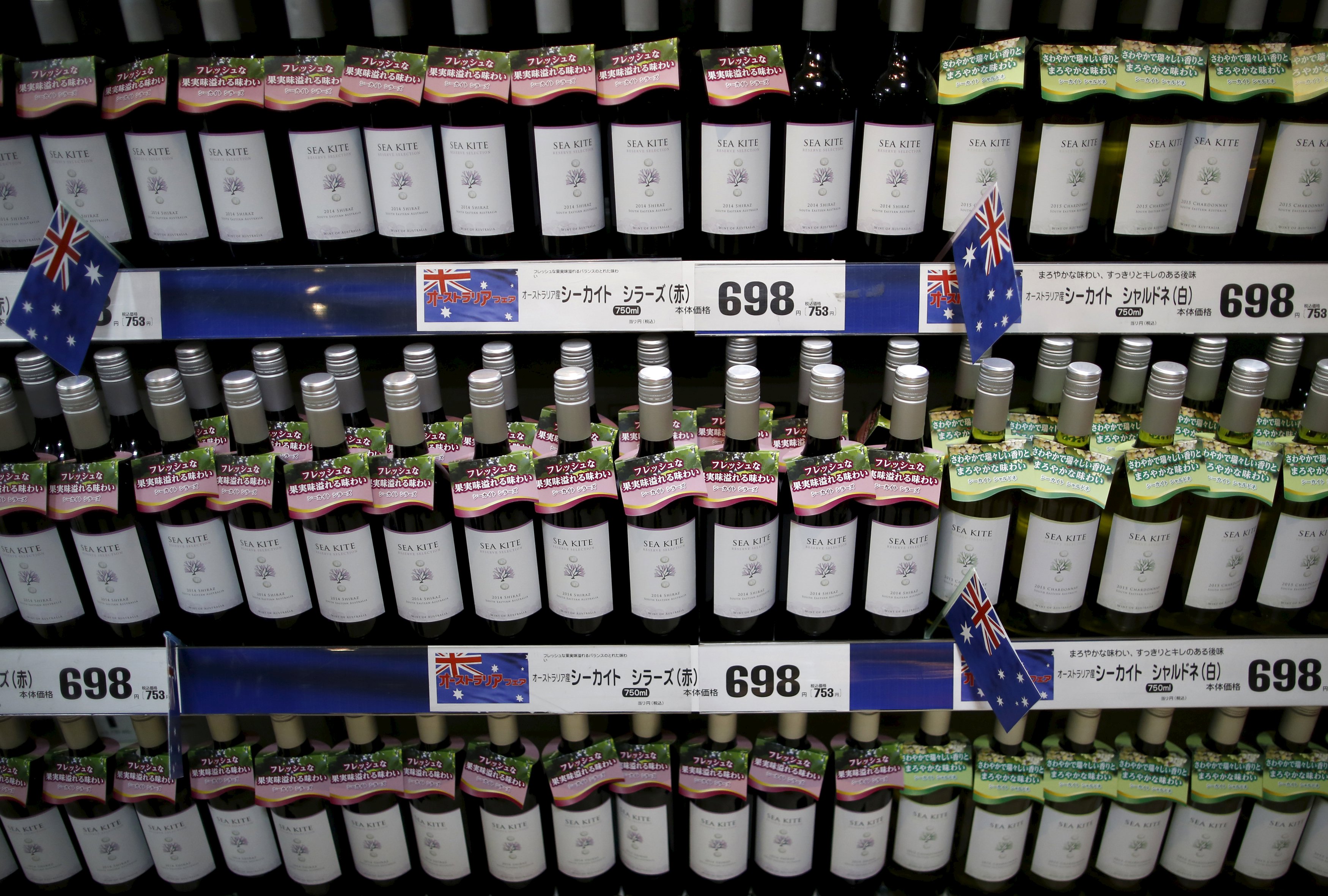 Imported Australian wine is displayed at a Tokyo store Monday. Tariffs on imported wine are set to go under the TPP. | REUTERS