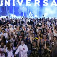 People dressed up like zombies take part in a Halloween event Saturday at Universal Studios Japan in the city of Osaka. | KYODO