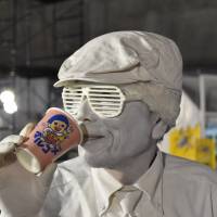 Acting up: A mime takes a drink &#8212; or pretends to &#8212; at the Moshi Moshi Nippon Festival on Sunday. | MIINA YAMADA