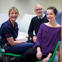 Pauline Cafferkey (right) smiles alongside Dr. Michael Jacobs and Senior Matron Breda Athan at the Royal Free Hospital in London on Wednesday. The Scottish nurse who contracted and initially recovered from Ebola, but then suffered a relapsing illness, has now recovered from meningitis caused by the Ebola virus persisting in her brain. | REUTERS / ROYAL FREE HOSPITAL