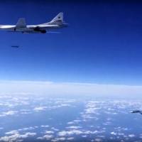 A Russian air force Tu-160 bomber launches a cruise missile while being escorted by an Su-30SM on a combat mission against a target in Syria, according to information provided Friday by Russian Defense Ministry. Russian long-range bombers and navy ships have launched 101 cruise missiles in four days, including 18 fired by Russian navy ships from the Caspian Sea on Friday, according to information released by Russian Defense Ministry. | RUSSIAN DEFENSE MINISTRY PRESS SERVICE / AP