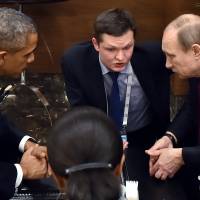 U.S. President Barack Obama speaks with Russian President Vladimir Putin (right) prior to the opening session of the G-20 summit in Antalya, Turkey, Sunday. | RIA-NOVOSTI, KREMLIN POOL PHOTO VIA AP