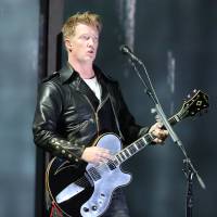 Joshua Homme, of Queens of the Stone Age, performs at the 56th annual Grammy Awards in Los Angeles in January 2014. Homme had been scheduled to perform Friday with his band Eagles of Death Metal at the Bataclan venue in Paris where patrons were taken hostage. | MATT SAYLES/INVISION/AP