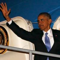 U.S. President Barack Obama waves at the door of Air Force One at Antalya International Airport in Antalya, Turkey, on Monday prior to flying to the Philippines to attend the Asia-Pacific Economic Cooperation summit. | REUTERS