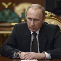 Russian President Vladimir Putin chairs a meeting on the Russian plane crash in Egypt at the Kremlin on Tuesday. | REUTERS