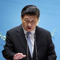Chinese President Xi Jinping delivers his speech in Singapore on Saturday. | AP