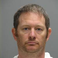 This booking photo provided by the Delaware Department of Justice shows Lee Robert Moore. Federal authorities say Moore, a Secret Service agent from Maryland, sent obscene images and texts to someone he thought was a young Delaware girl, sometimes doing it while on duty at the White House. | DELAWARE DEPARTMENT OF JUSTICE VIA AP