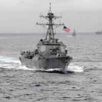 The USS Lassen guided-missile destroyer sails in the Pacific Ocean in November 2009. In a challenge to China\'s territorial claims in the South China Sea, the U.S. Navy sent the Lassen within 12 nautical miles of artificial islands built by China in waters near the Spratly islands Tuesday. | REUTERS
