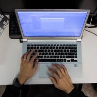 A student practices during a cyberdefense programming class in the so-called war room at Korea University in Seoul on Thursday. | BLOOMBERG