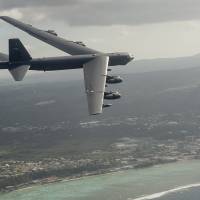 A U.S. Air Force B-52 Stratofortress bomber flies off the coast of Guam on Feb. 17 during Exercise Cope North. The annual drills take place in coordination with Japan\'s Air Self Defense Force and are aimed at maintaining interoperability between the two allies. | U.S. AIR FORCE
