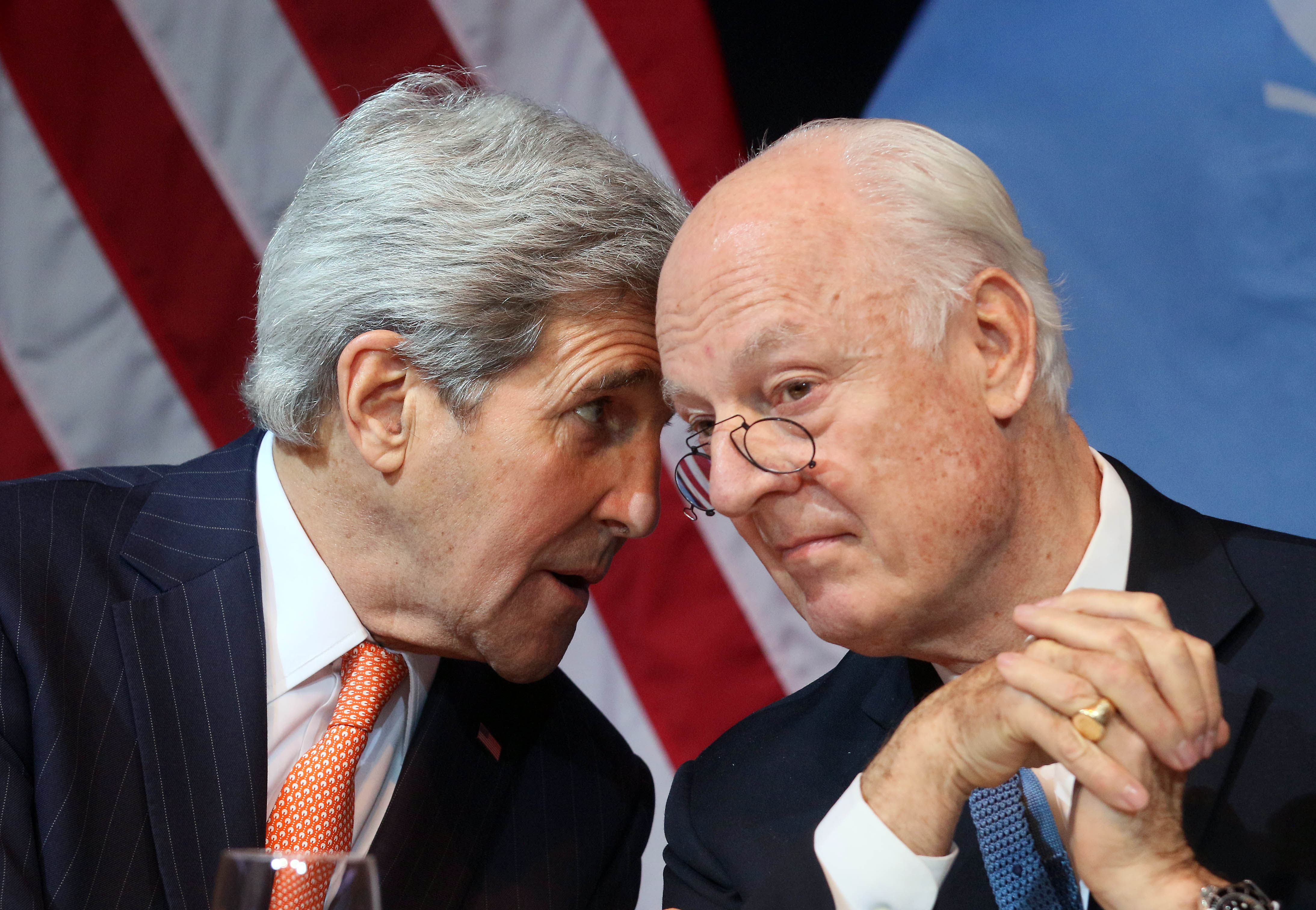 U.S. Secretary of State John Kerry speaks with U.N. Special Envoy for Syria Staffan de Mistura during a news conference in Vienna on Saturday. | AP