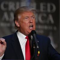 Republican presidential candidate Donald Trump speaks during a Nov. 3 press conference at an event to launch his new book \"Crippled America: How to Make America Great Again\" at Trump Tower in New York. Trump called Sunday for the return of waterboarding, a near-drowning interrogation technique widely denounced as torture, saying it was \"peanuts\" compared to what Islamic State is doing. | AFP-JIJI