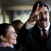 Venezuelan President Nicolas Maduro and first lady Cilia Flores arrive at the United Nations Human Rights Council for a special session in Geneva on Thursday. | REUTERS