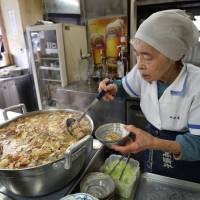 Hiro Kanazawa serves \"nikomi\" innards at Akitaya, a restaurant in Tokyo\'s Hamamatsucho district. | RIE ISHII
