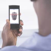 Fingerprint recognition, one of the most common biometric identification methods, is demonstrated on a smartphone. | ISTOCK