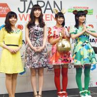 Members of the Japanese idol group Akamaru Dash (right and far right) pose for a photo during the \"Japan Weekend\" tourism promotion event in Bangkok on Saturday. | KYODO