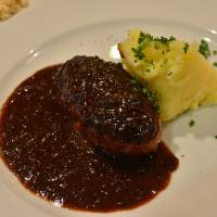 Succulent hamburger hidden under a rich red wine sauce | J.J. O\'DONOGHUE