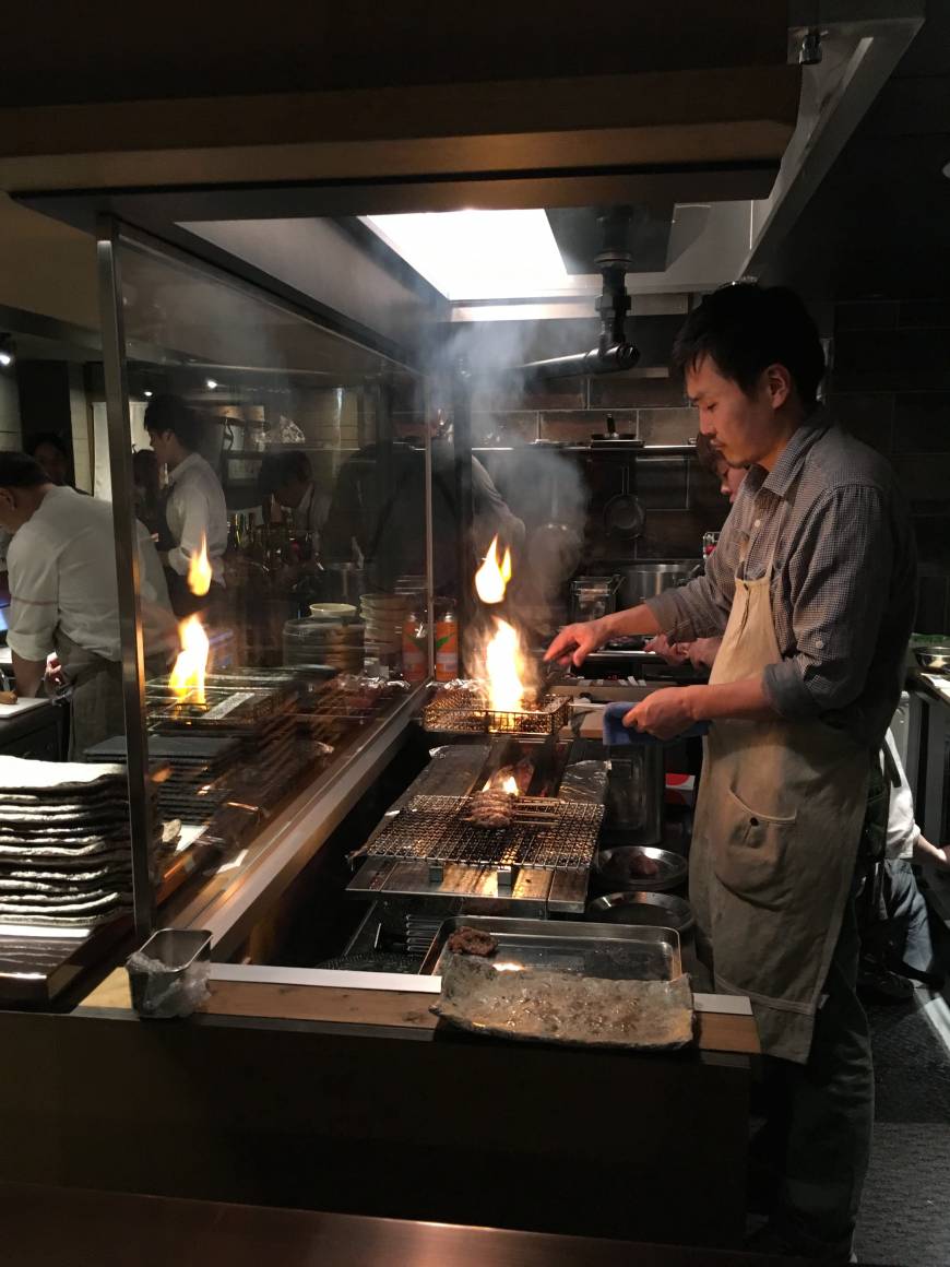 Na Camo Guro On fire: Duck is prepared at Na Camo Guro's grill. | ROBBIE SWINNERTON