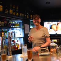 Scott Barclay, owner of Bar Rhythm  in Tokyo’s Musashi-Koyama neighborhood,  says property developers “don’t care about people.” | SATOKO KAWASAKI