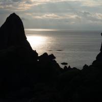 The rock island ensemble of Tenjyo-ka (Heavenly World), with the pinnacle of Kannon-iwa. Nishinoshima: Oki's island of sanctuary
