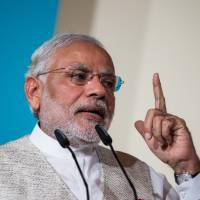 Waiting for Abe: Indian Prime Minister Narendra Modi, seen here addressing the 37th Singapore Lecture in Singapore last week, will welcome Prime Minister Shinzo Abe in India next month. | BLOOMBERG