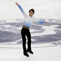 Yuzuru Hanyu performs during the men\'s short program at the NHK Trophy on Friday in Nagano. Hanyu won the short program with a world-record score of 106.33 points. | REUTERS