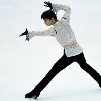 Yuzuru Hanyu performs during the men\'s free skate on Saturday at the NHK Trophy in Nagano. Hanyu captured the title with a world-record score of 322.40 points in the two-day competition. | AFP-JIJI