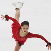 Satoko Miyahara skates during the women\'s short program at the NHK Trophy on Friday in Nagano. Miyahara is in first place with 69.53 points. | AP