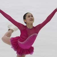 Satoko Miyahara competes during the women\'s free skate on Saturday at Nagano\'s Big Hat. Miyahara, who led after the short program, won the women\'s competition with 203.11 points. | AP