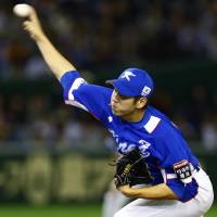 South Korea starter Rhee Dae-eun fires a pitch in the first inning on Thursday. | AP