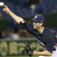 United States starter Zeke Spruill fires a pitches in the first inning against Mexico on Friday during the Premier 12 semifinals. | AP