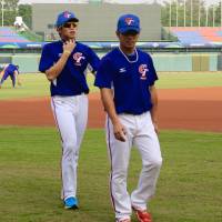 Taiwan left-handed pitcher Chen Kuan-yu (left), seen during Friday\'s team practice, is trying to capitalize on his experience in Japan to help his nation at the Premier 12 tournament. | KAZ NAGATSUKA