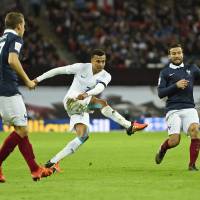 Dele Alli (center) scores England\'s first goal in Tuesday\'s friendly against France. | REUTERS