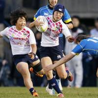 Japan\'s Mifuyu Koide runs at the Kazakhstan defense during the second leg of the Asian qualifiers for the Rio Olympics rugby sevens competition in Tokyo on Sunday. | KYODO