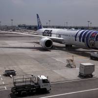 Guests got a sneak peek of All Nippon Airways\' \"Star Wars\"-themed Boeing 787 Dreamliner aircraft and were able to take photos of the business class section during a special fan event at Singapore\'s Changi Airport on Thursday, Nov. 12. The aircraft was opened to the media for its first Asian stop outside Japan. | REUTERS