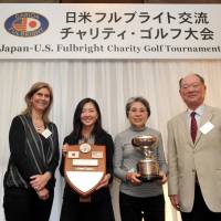 Terumi Fujisaki (second from right) won the Prime Minister\'s Cup, while Sari Ichise (second from left) was awarded the U.S. Ambassador\'s Plaque, at the 39th annual Japan-U.S. Fulbright Charity Golf Tournament at the Totsuka Country Club in Kanagawa Prefecture on Oct. 26. Also pictured are the U.S. Embassy\'s Minister Counselor for Public Affairs Margot Carrington (left) and Fulbright Alumni Association of Japan President Chitoo Bunno. | YOSHIAKI MIURA
