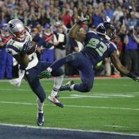 New England\'s Malcolm Butler intercepts a pass intended for Seattle\'s Ricardo Lockette in the final seconds of the Super Bowl in February. The Patriots beat the Seahawks 28-24 in one of the most dramatic finishes in the history of the game. | AP