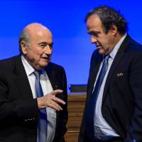 FIFA president Sepp Blatter (left) and UEFA president Michel Platini, previously a frontrunner to succeed Blatter, presided over an ongoing corruption scandal that reached the highest levels of soccer. More than a dozen FIFA officials have been arrested on various charges. | AFP-JIJI