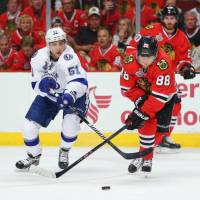 Chicago Blackhawks star Patrick Kane (right) helped his team defeat the Tampa Bay Lightning and capture its third Stanley Cup title in six years in June. | USA TODAY / REUTERS