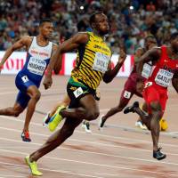 Usain Bolt dashes to victory in the men\'s 200-meter final at the world championships in August in Beijing. With the victory, Bolt claimed his record 10th gold medal at worlds. | AP