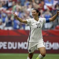 U.S. star Carli Lloyd is ecstatic after scoring her third goal of the first half against Nadeshiko Japan in the Women\'s World Cup Final in July in Vancouver, British Columbia. | AP