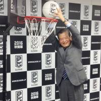 Japan Basketball Association president Saburo Kawabuchi (above right) dunks a ball at a September news conference announcing the formation of the B. League, Japan\'s new pro circuit. | KYODO