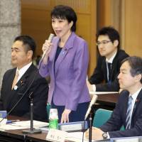 Internal Affairs and Communications Minister Sanae Takaichi speaks at a panel meeting on Wednesday at the ministry. | KYODO