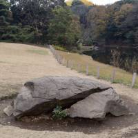 In front of the Treasure House is the kameishi, or turtle stone. It has been placed near the pond in a spot that is believed to be a power spot. | MIINA YAMADA