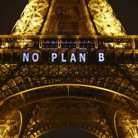 The slogan \"NO PLAN B\" is projected on the Eiffel Tower as part of the COP21 United Nations Climate Change Conference in Paris on Friday. | AP